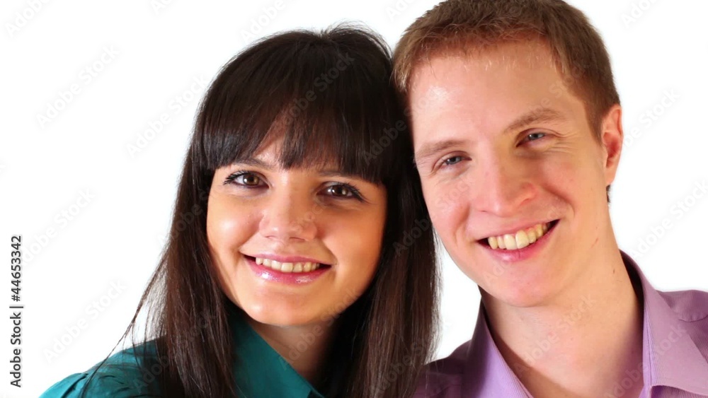 Young boy and girl huddled their heads and smile Young boy and girl huddled their heads and smile