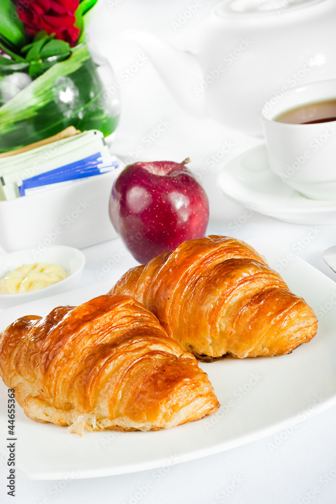 continental breakfast of croissant pastry and tea continental breakfast of croissant pastry and tea