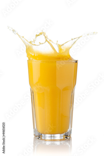 splash of orange juice in a glass