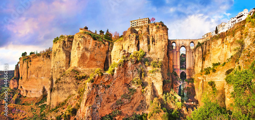Leinwand Poster Panoramic view of the city of Ronda at sunset, Andalusia, Spain