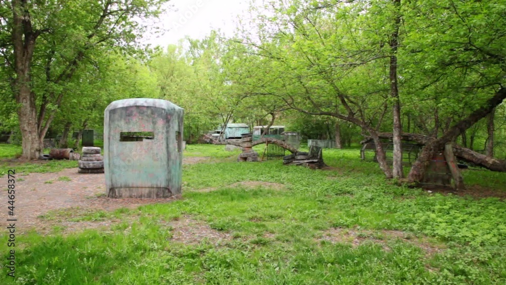 Broken old bus stand on paintball playground Broken old bus stand on paintball playground