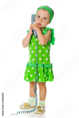 Adorable baby with phone handset
