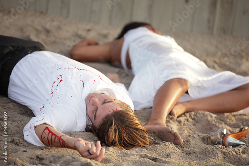 Fotografie Murder victims on the sand