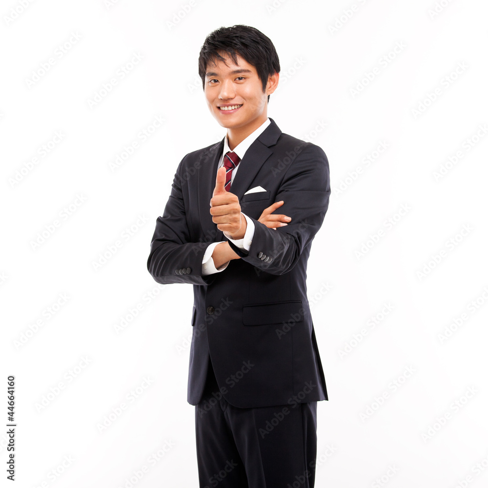 Showing thumb young Asian business man. Showing thumb young Asian business man.