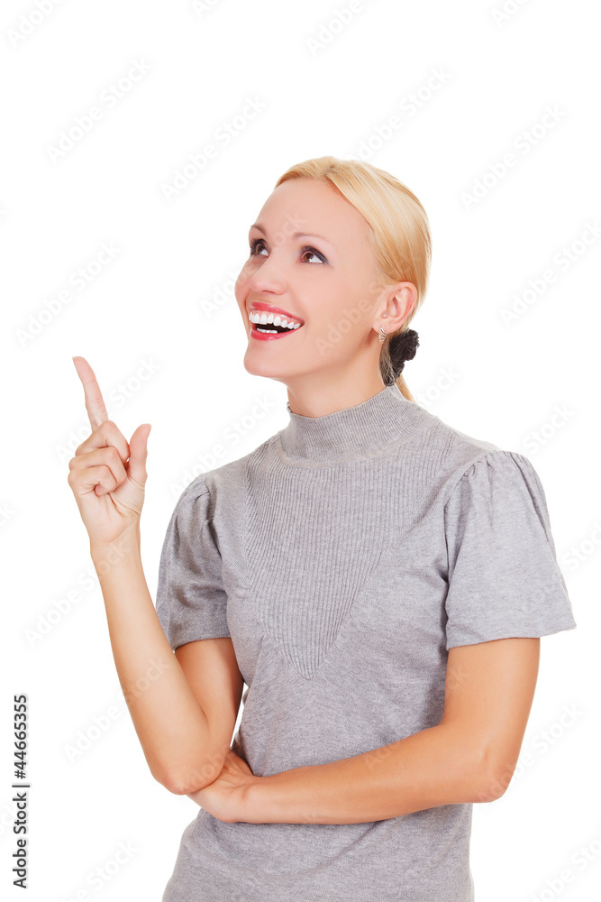 Smiling woman pointing at something interesting Smiling woman pointing at something interesting