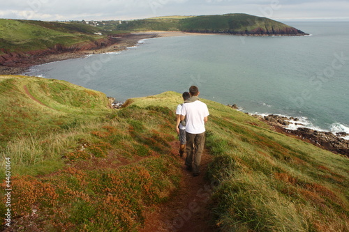 walkers in Pembrokeshire Coastal National Park photo