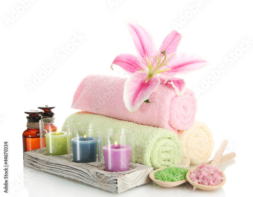 Fototapeta Naklejka Na Ścianę i Meble -  towels with lily, aroma oil,  candles and sea salt isolated