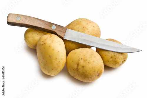 raw potatoes with knife
