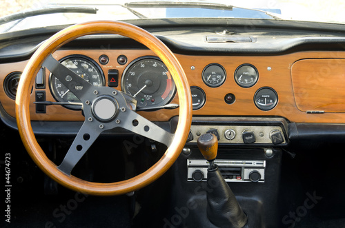 wooden dashboard of a vintage car