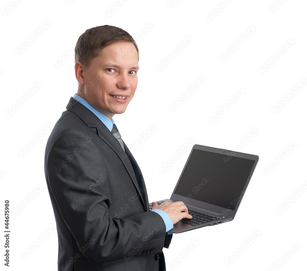 handsome young business man and laptop handsome young business man and laptop