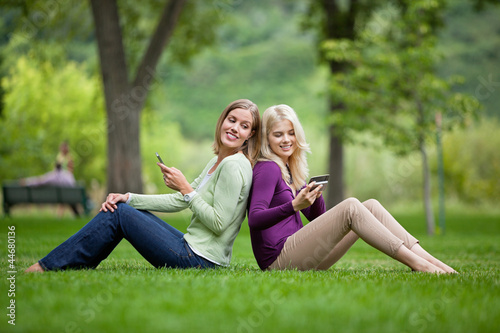 Women With Cellphones In Park