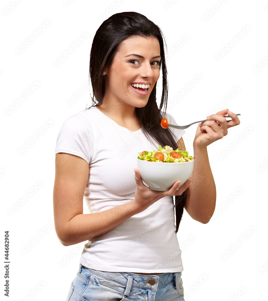 Young Girl Eating Salad From Bowl