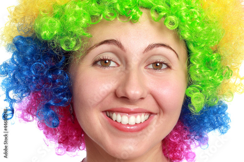 Young woman smiling with clown hair