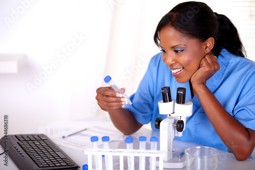 Scientific young female working at laboratory
