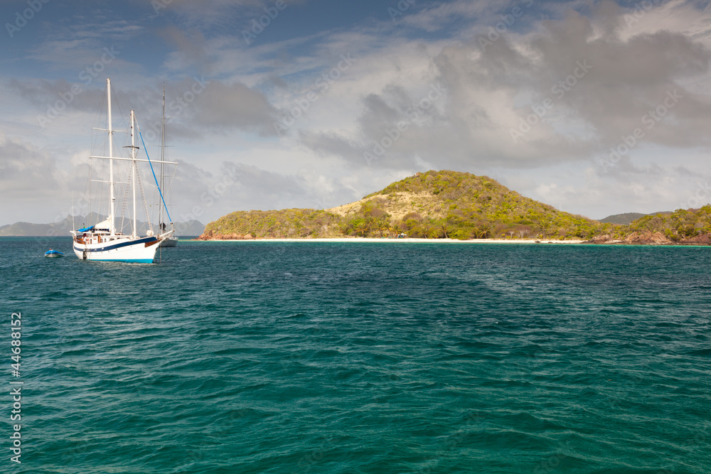 White yacht near the Caribbean island