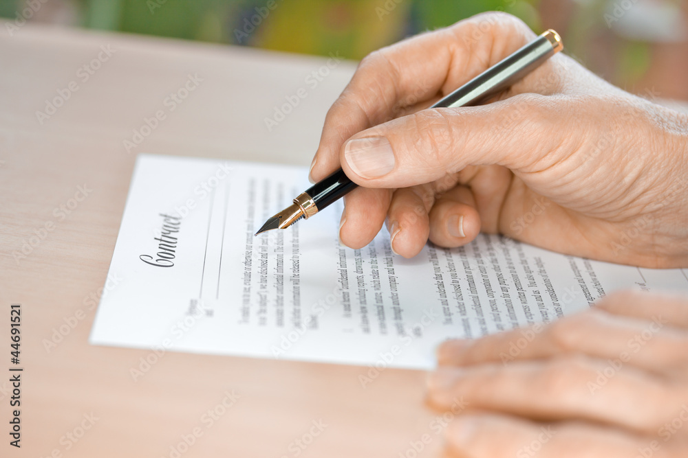 Hand Proofreading a Contract with Fountain Pen Hand Proofreading a Contract with Fountain Pen