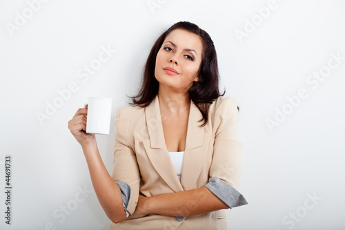 businesswoman holding cup of drink