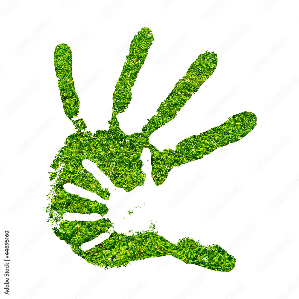 Conceptual hand print made of fresh green grass