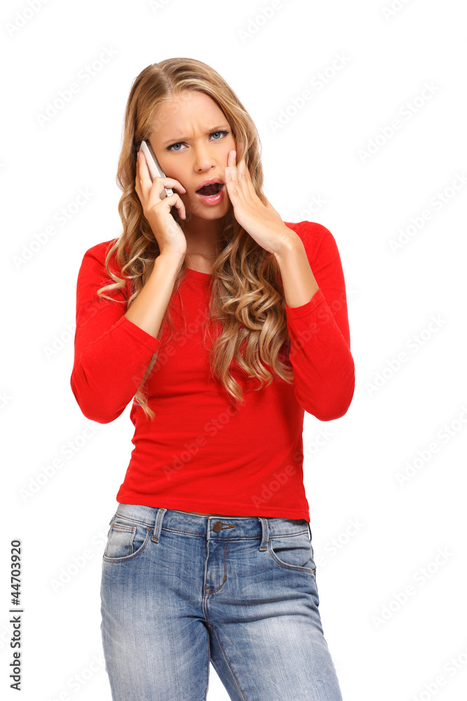 surprised blond woman talking on cellphone surprised blond woman talking on cellphone