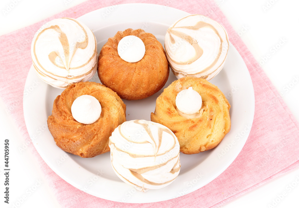 Appetizing cupcakes with cream isolated on white Appetizing cupcakes with cream isolated on white