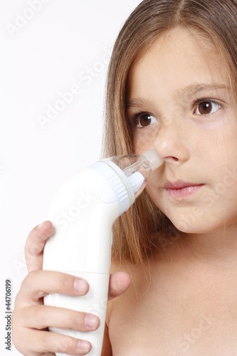 Child with nasal aspirator