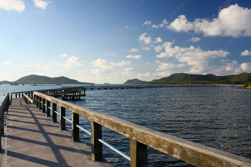 Fototapeta premium concrete jetty with railing over sea