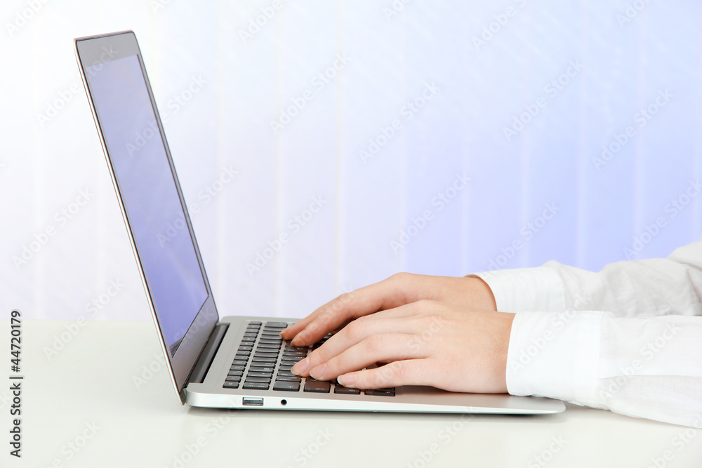 Closeup of businesswoman hands typing on laptop computer Closeup of businesswoman hands typing on laptop computer