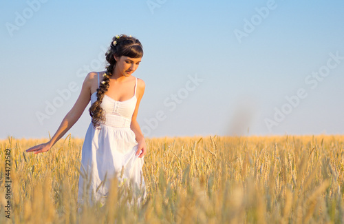 Girl on wheat field