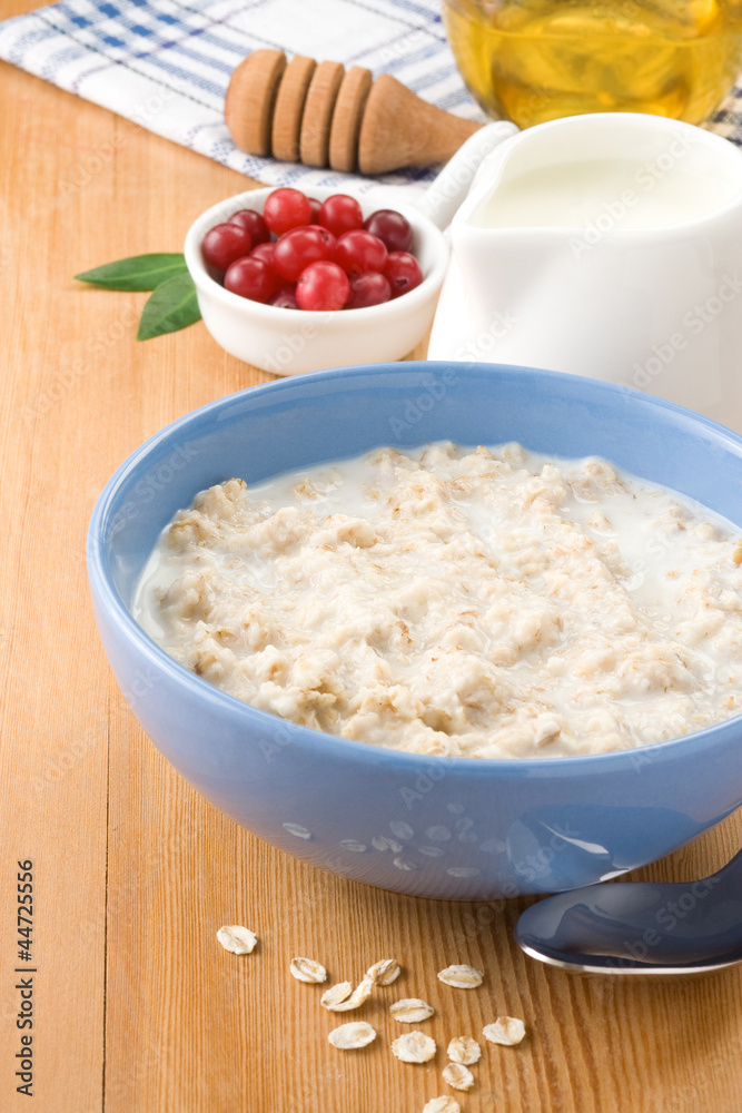 oatmeal with milk and honey on wood oatmeal with milk and honey on wood