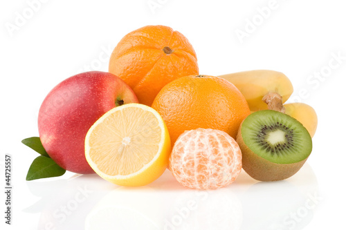 fresh tropical fruits and slices isolated on white