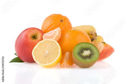 fresh tropical fruits and slices isolated on white