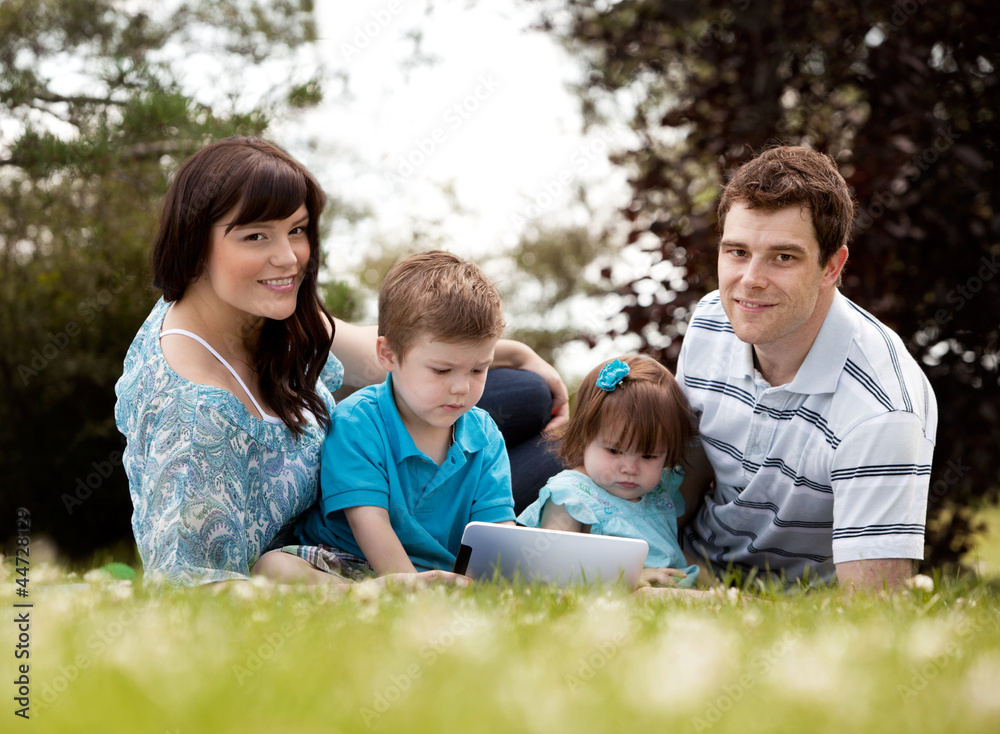 Family with Digital Tablet Outdoors Family with Digital Tablet Outdoors