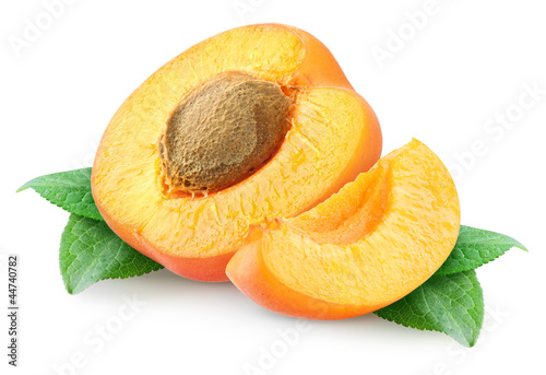 Isolated apricots. Pieces of fresh apricot fruits isolated on white background