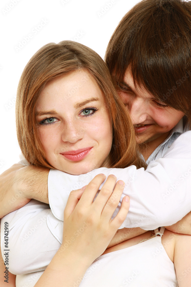 A young loving couple, isolated on white A young loving couple, isolated on white