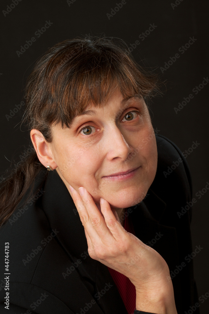 Woman with expressive eyes and hand touching face Woman with expressive eyes and hand touching face