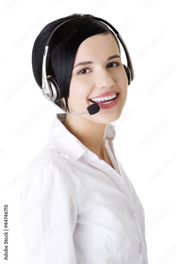 Pretty young call center worker wearing a headset Pretty young call center worker wearing a headset