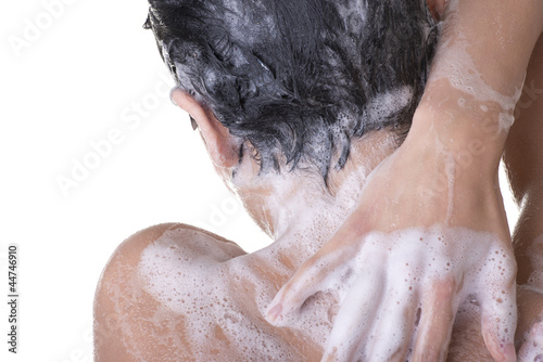 Young fit woman in shower
