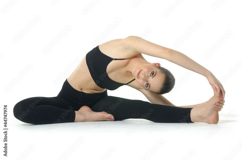 Photo of young woman exercising yoga Photo of young woman exercising yoga