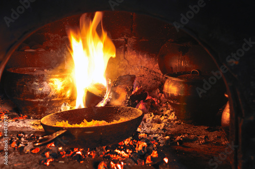 cooking in an old fireplace