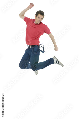 casual young man jumping