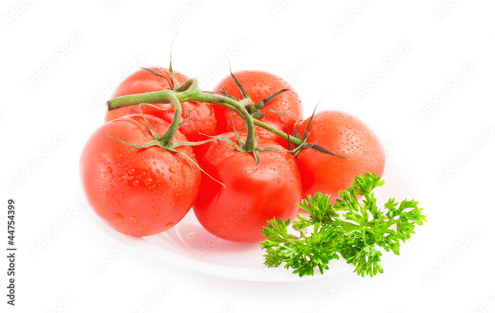 Ripe tomatoes with parsley on plate isolated on white background Ripe tomatoes with parsley on plate isolated on white background
