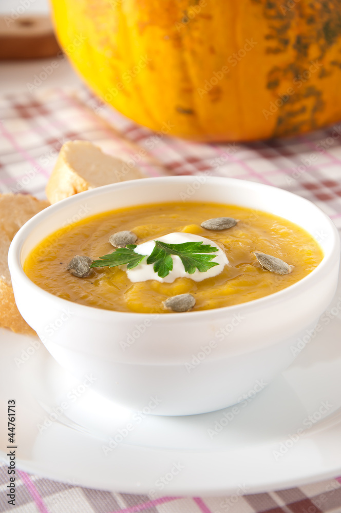 Cream of pumpkin soup with sour cream sauce Cream of pumpkin soup with sour cream sauce