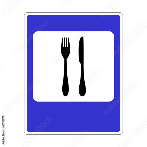 A road sign with a picture of cutlery