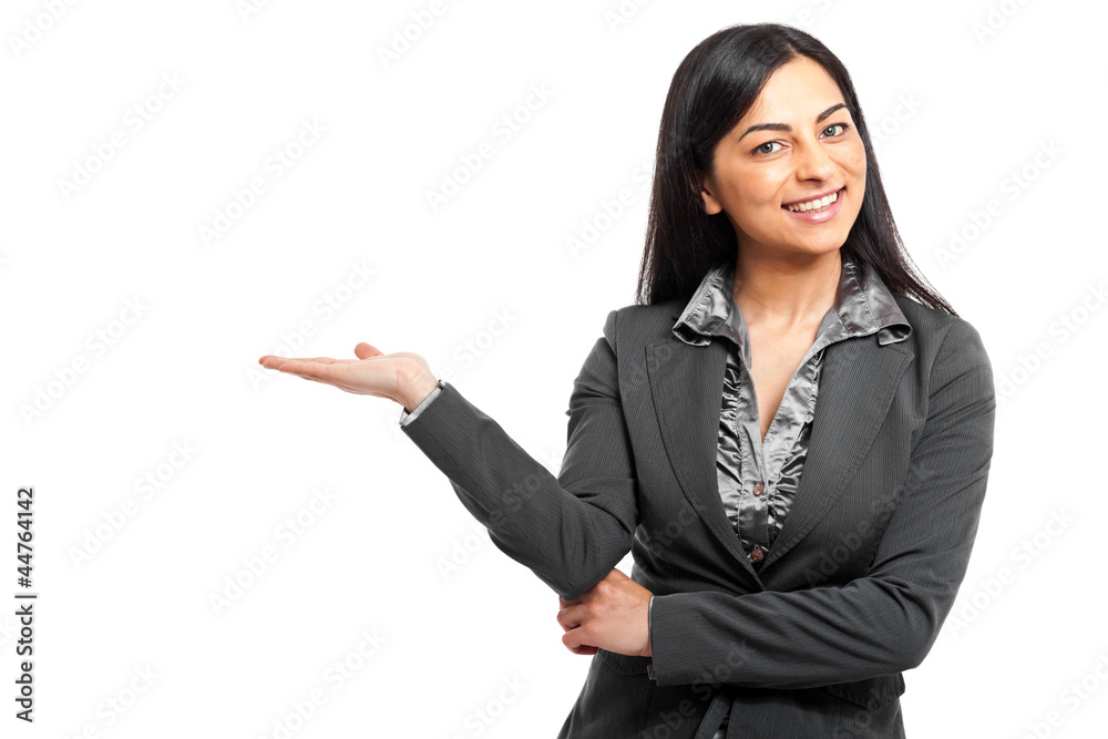 Smiling businesswoman showing her empty hand Smiling businesswoman showing her empty hand