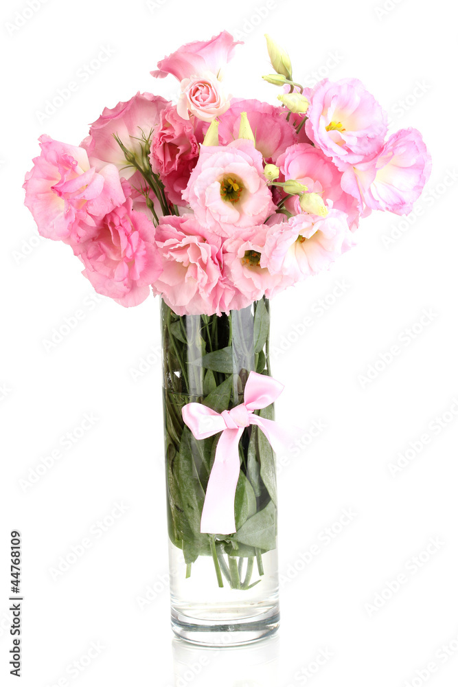 bouquet of eustoma flowers in vase, isolated on white