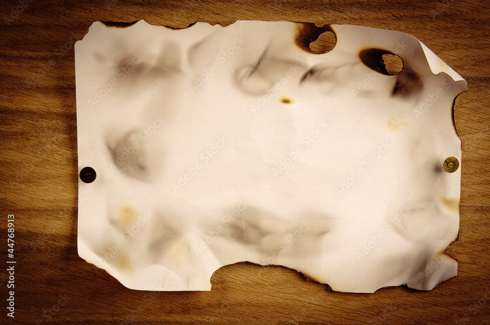 Old paper on wooden background