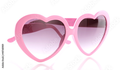 Pink heart-shaped sunglasses isolated on white
