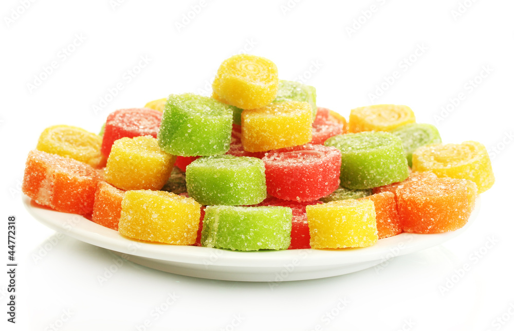 colorful jelly candies on plate isolated on white. colorful jelly candies on plate isolated on white.