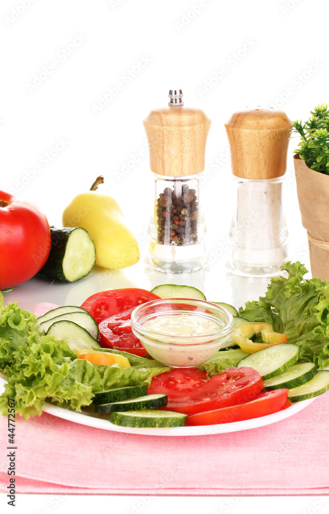 Chopped vegetables and sauce on plate isolated on white Chopped vegetables and sauce on plate isolated on white