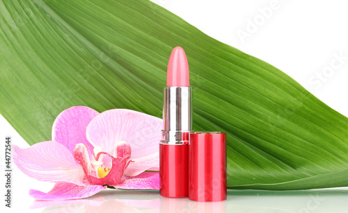 lipstick on green leaf isolated on white